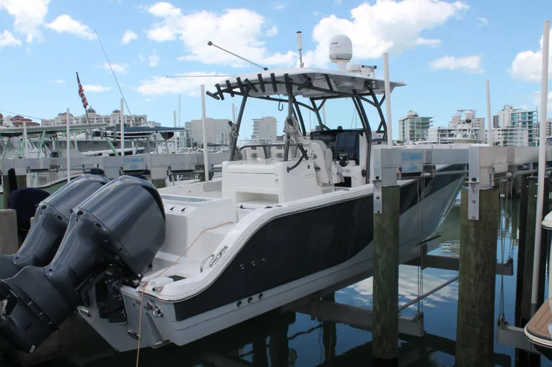  Yacht Photos Pics 2018 Sea Fox 328 Commander boat docked at marina with twin engines.
