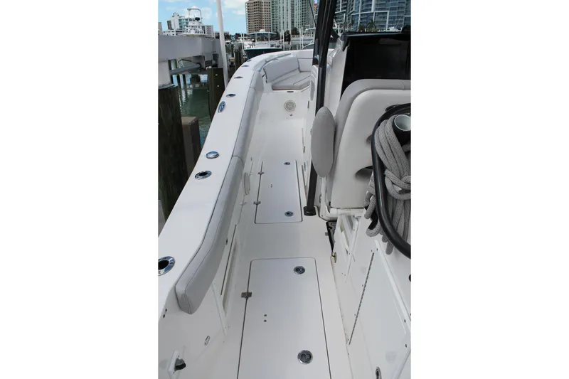  Yacht Photos Pics 2018 Sea Fox 328 Commander boat deck with seating and storage compartments.