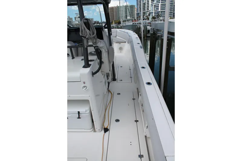  Yacht Photos Pics 2018 Sea Fox 328 Commander boat docked, showcasing spacious deck and modern design.