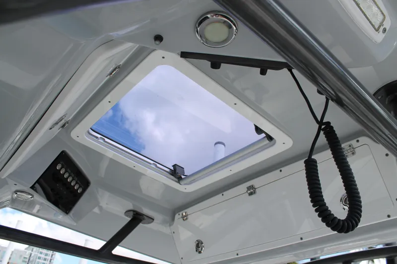  Yacht Photos Pics Interior view of 2018 Sea Fox 328 Commander boat's cabin ceiling with hatch and controls.