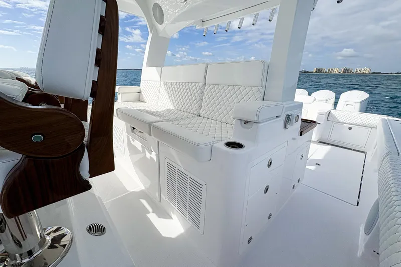  Yacht Photos Pics Luxurious interior of 2026 HCB 48 Campeon boat with white seating and ocean view.