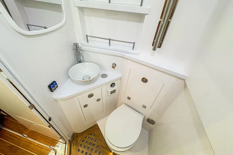  Yacht Photos Pics Luxurious bathroom in 2026 HCB 48 Campeon boat, featuring modern fixtures and elegant design.