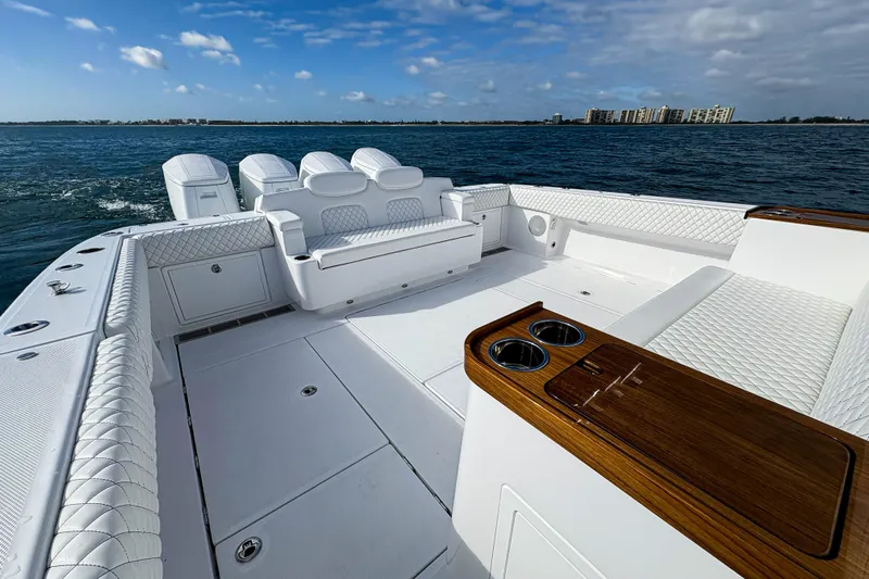  Yacht Photos Pics Luxurious 2026 HCB 48 Campeon boat interior with white seating and ocean view.