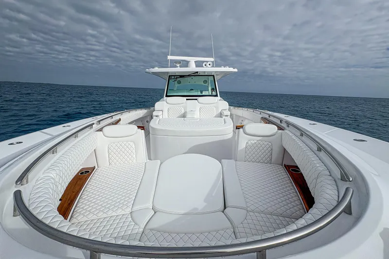  Yacht Photos Pics Luxurious 2026 HCB 48 Campeon yacht with elegant seating, cruising on open water.