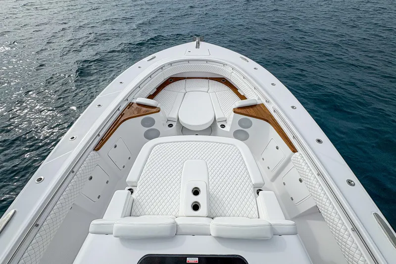 Yacht Photos Pics Luxurious 2026 HCB 48 Campeon boat interior with white seating and ocean backdrop.