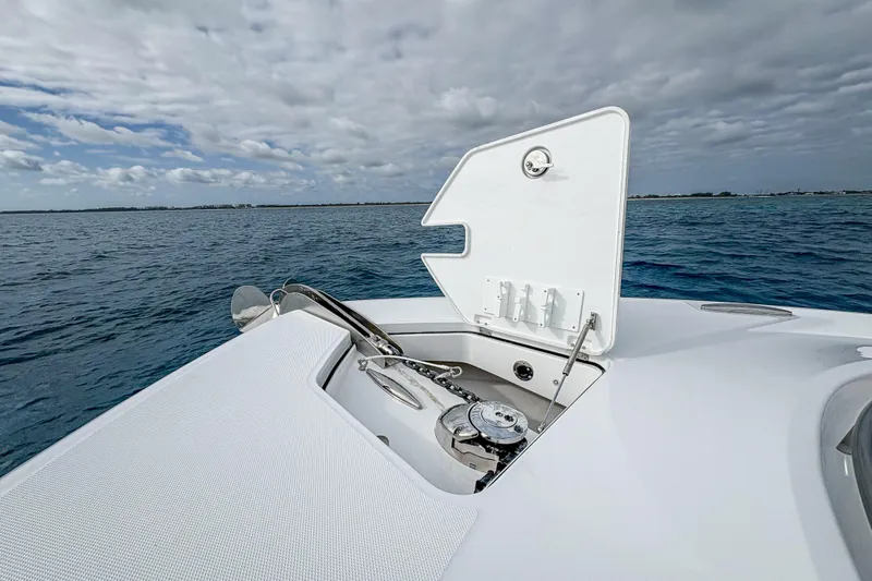  Yacht Photos Pics 2026 HCB 48 Campeon boat anchor compartment open on calm ocean waters.