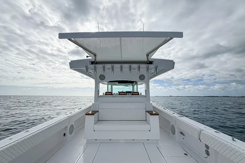  Yacht Photos Pics 2026 HCB 48 Campeon boat on open water under cloudy sky.