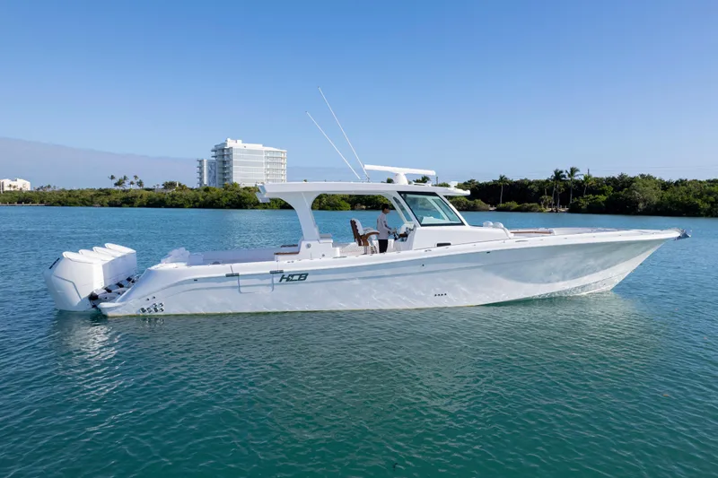 Yacht Photos Pics 2026 HCB 48 Campeon boat on calm water, clear sky background.
