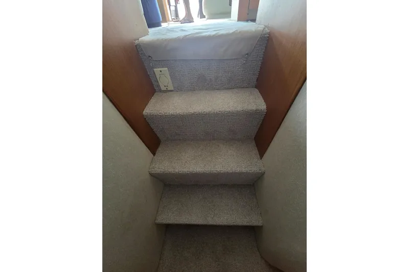  Yacht Photos Pics Carpeted stairs inside 2004 Ocean Yachts 43 Super Sport boat.