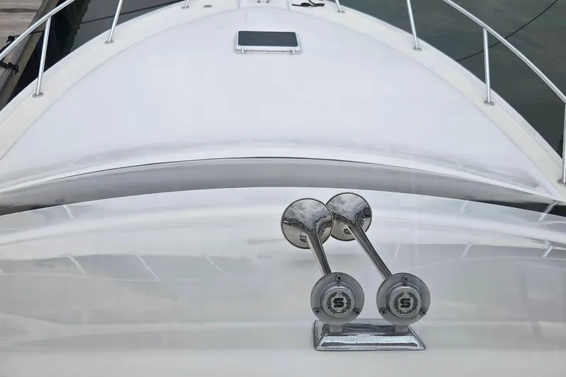  Yacht Photos Pics 2004 Ocean Yachts 43 Super Sport yacht bow with chrome horns and sleek design.
