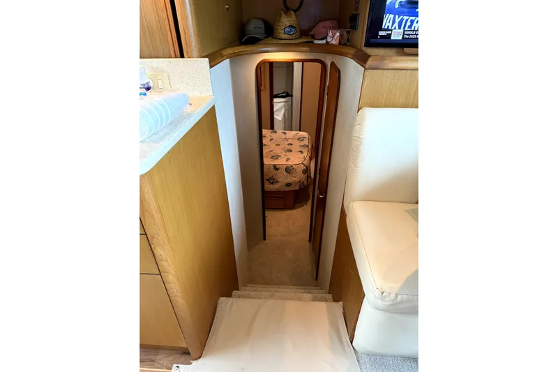  Yacht Photos Pics Interior view of 2004 Ocean Yachts 43 Super Sport, featuring cozy cabin and wooden cabinetry.