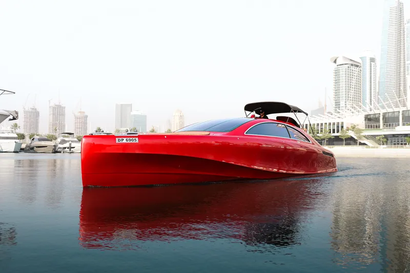 Mercedes Yacht Photos Pics Red 2016 Silver Arrow 460 GT yacht on water, city skyline in background.