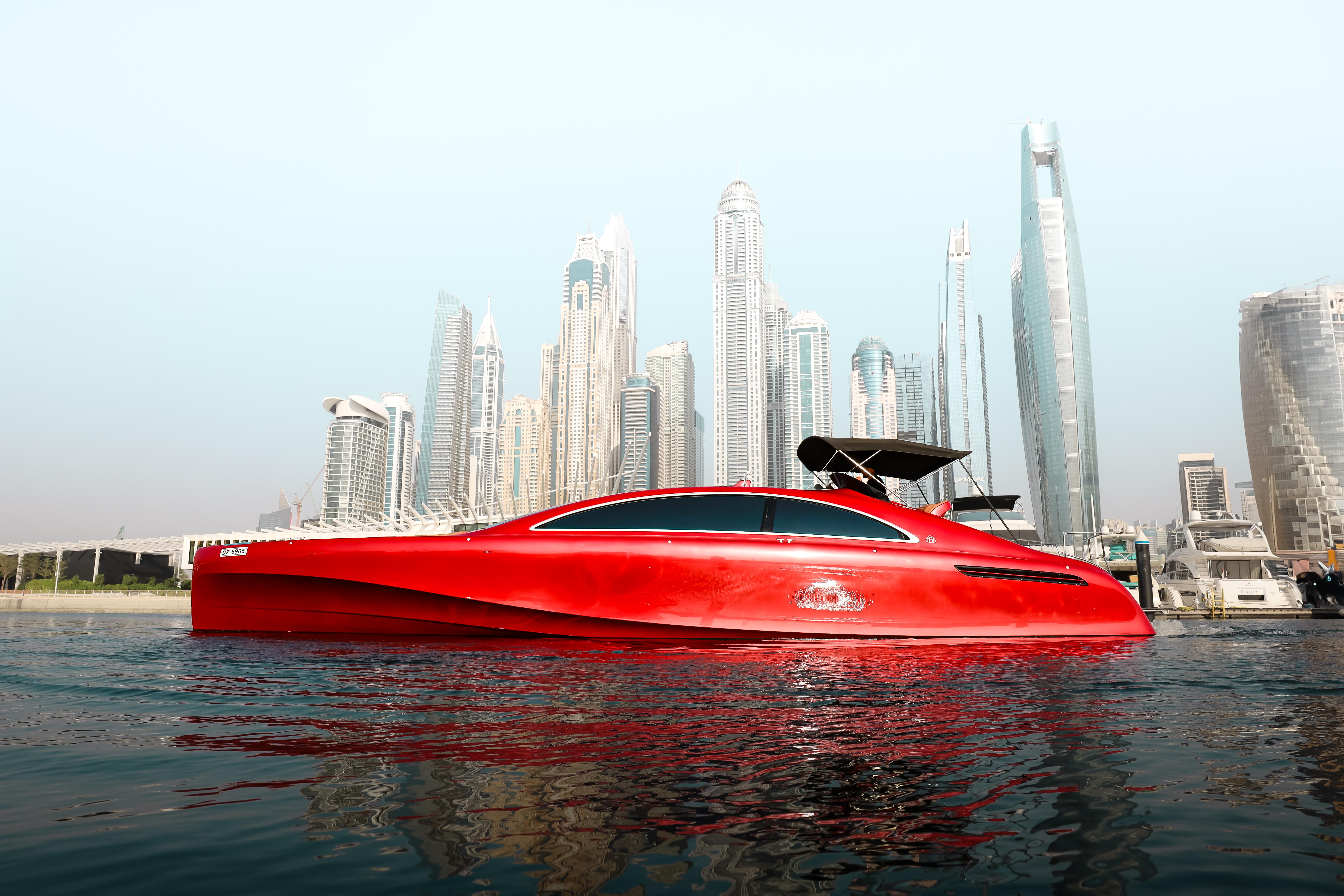 Red 2016 Silver Arrow 460 GT yacht in urban waterfront setting with skyscrapers.