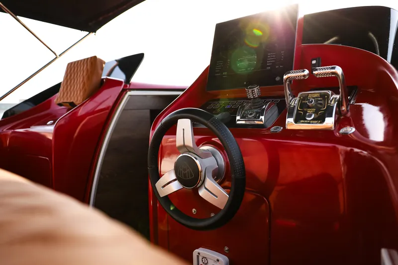 Mercedes Yacht Photos Pics 2016 Silver Arrow 460 GT yacht interior with sleek red dashboard and modern steering wheel.