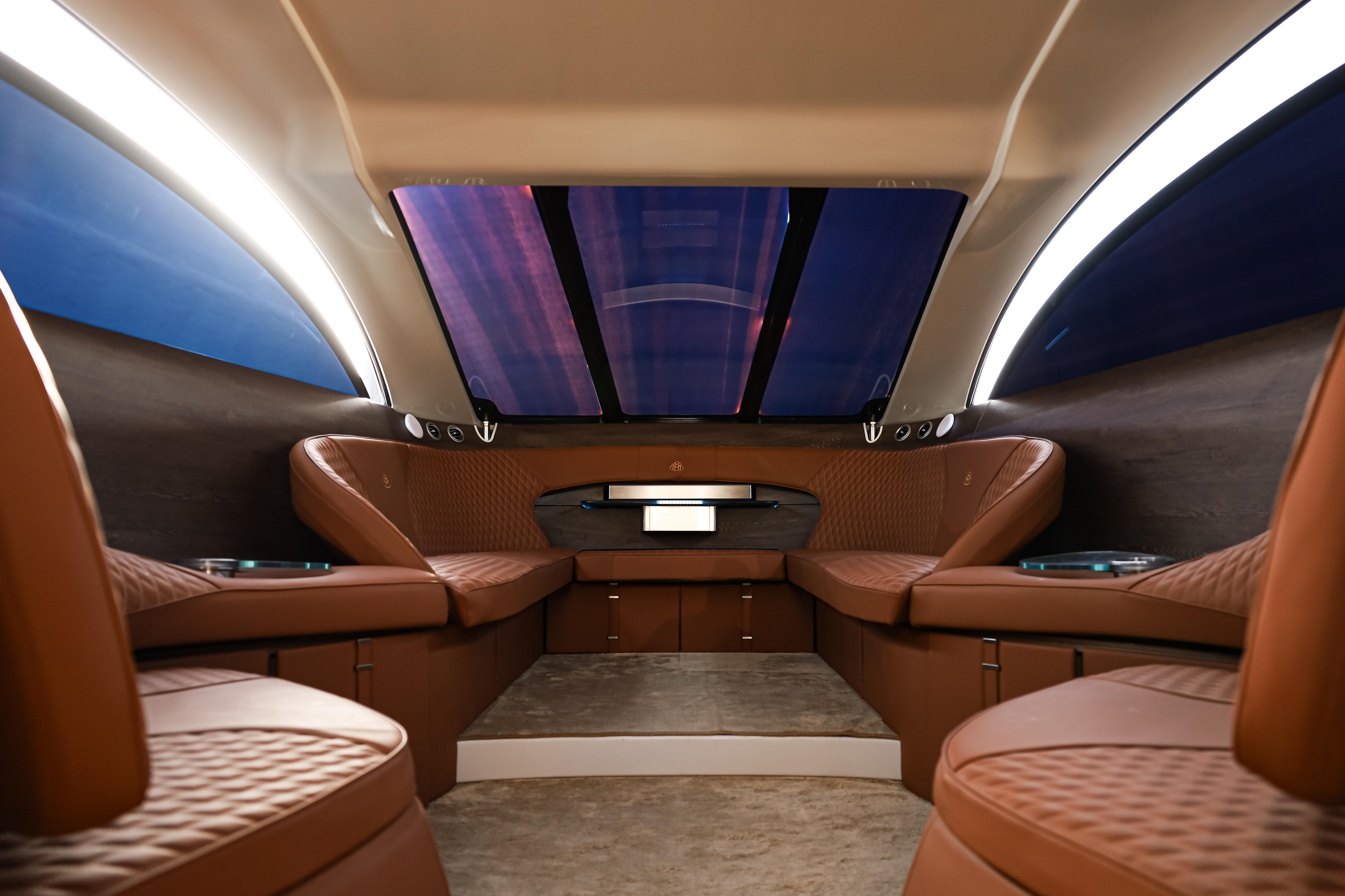 Luxurious interior of 2016 Silver Arrow 460 GT yacht with elegant brown seating.