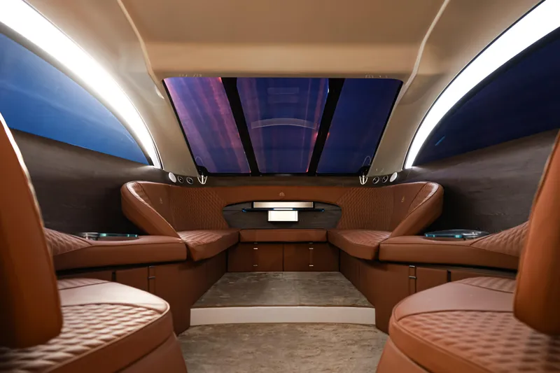 Mercedes Yacht Photos Pics Luxurious interior of 2016 Silver Arrow 460 GT yacht with elegant brown seating.