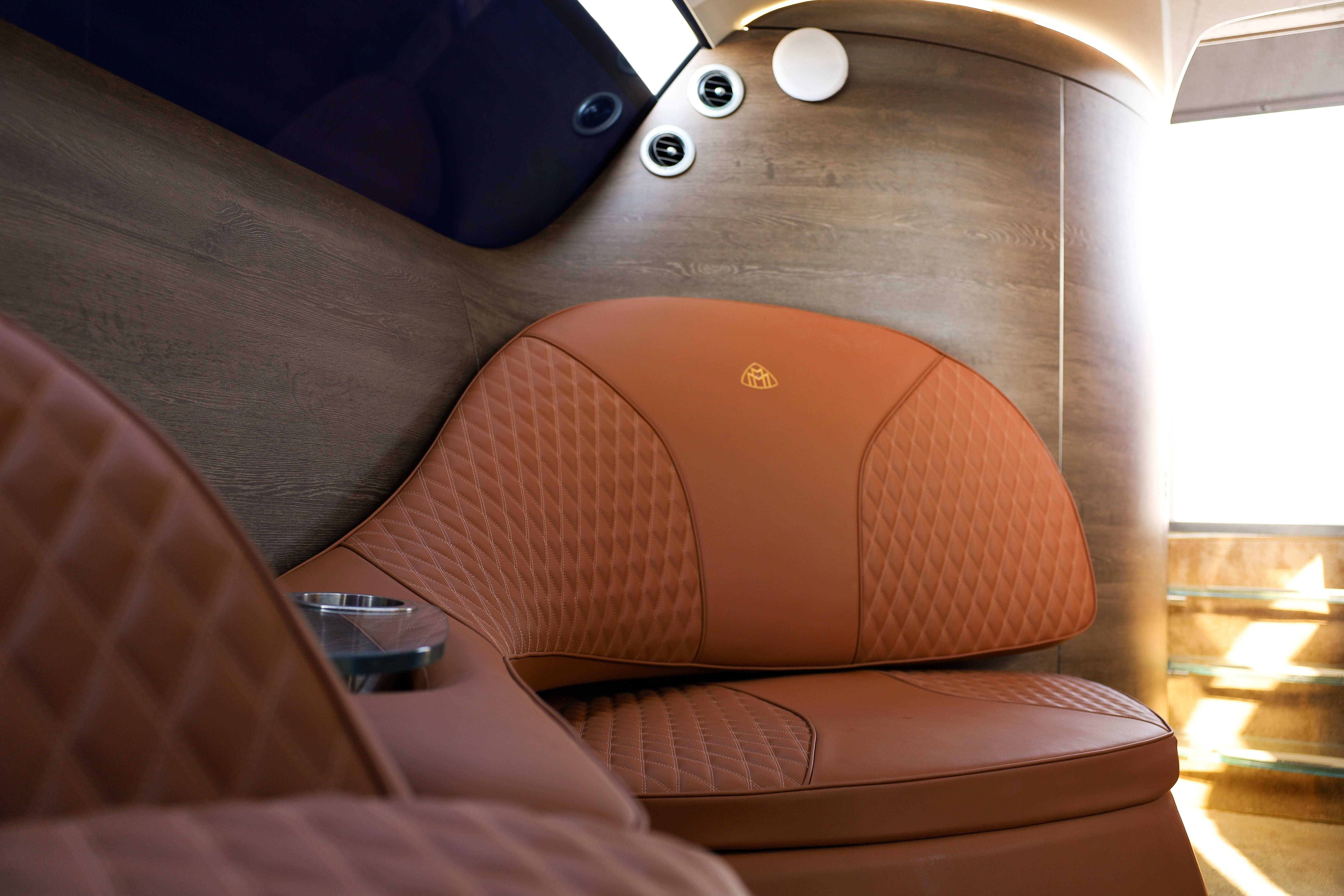 Luxurious interior of 2016 Silver Arrow 460 GT with elegant leather seating.