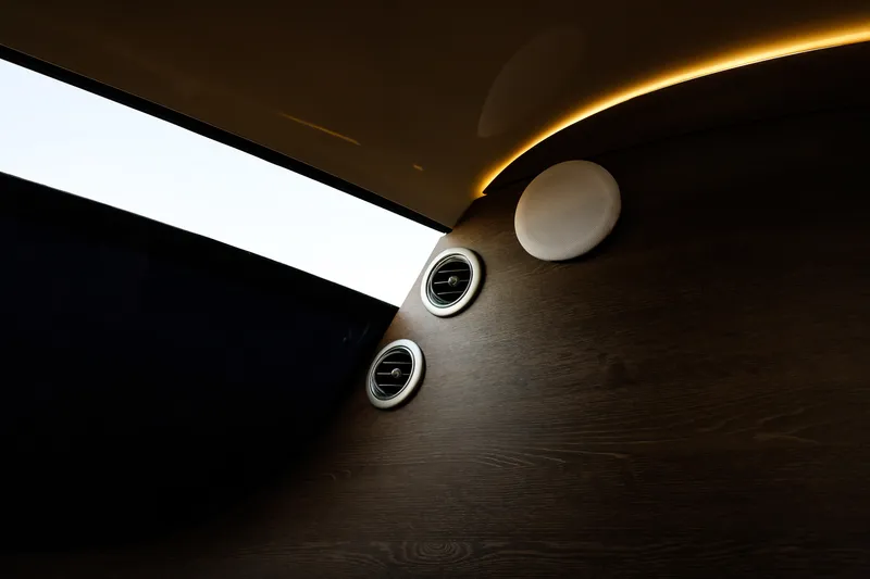 Mercedes Yacht Photos Pics Interior of 2016 Silver Arrow 460 GT yacht with sleek wood paneling and modern lighting.