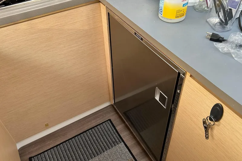  Yacht Photos Pics Galley area of 2019 Fountaine Pajot Helia 44 Evolution catamaran with compact fridge.