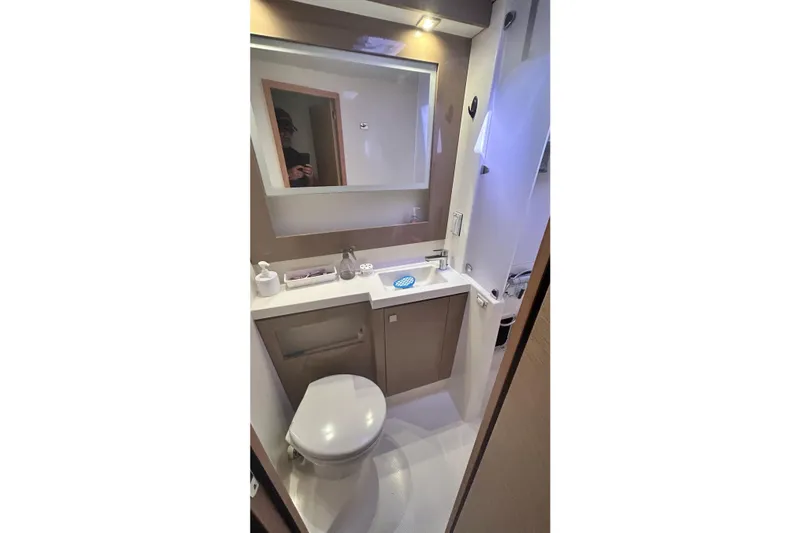  Yacht Photos Pics Modern bathroom in 2019 Fountaine Pajot Helia 44 Evolution yacht, featuring sleek design and amenities.