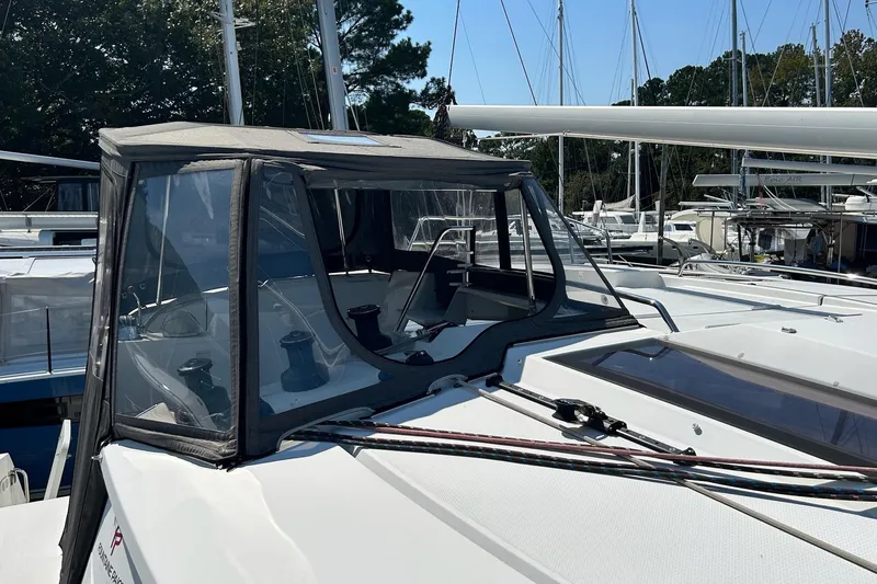  Yacht Photos Pics 2019 Fountaine Pajot Helia 44 Evolution catamaran with covered cockpit, docked in marina.