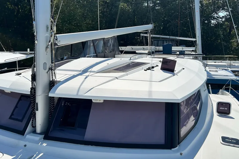  Yacht Photos Pics 2019 Fountaine Pajot Helia 44 Evolution catamaran, docked with visible sails and windows.