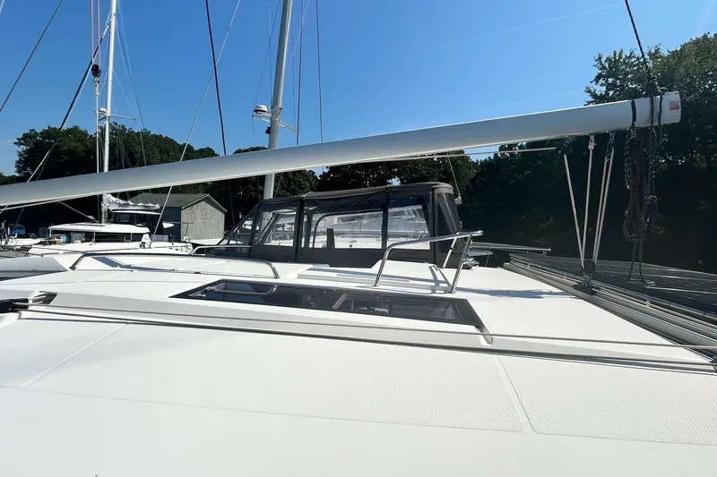  Yacht Photos Pics 2019 Fountaine Pajot Helia 44 Evolution catamaran, docked with clear sky background.