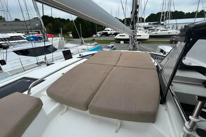  Yacht Photos Pics 2019 Fountaine Pajot Helia 44 Evolution catamaran with cushioned deck seating in marina.
