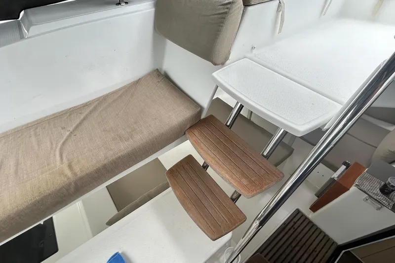  Yacht Photos Pics Interior view of 2019 Fountaine Pajot Helia 44 Evolution catamaran with wooden steps and seating.
