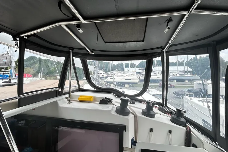  Yacht Photos Pics Interior view of 2019 Fountaine Pajot Helia 44 Evolution catamaran cockpit at marina.