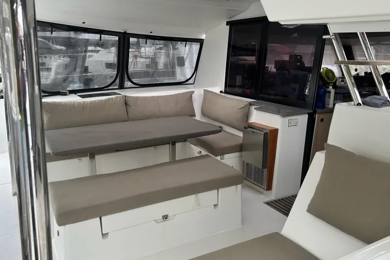  Yacht Photos Pics Interior of 2019 Fountaine Pajot Helia 44 Evolution catamaran with seating and table.