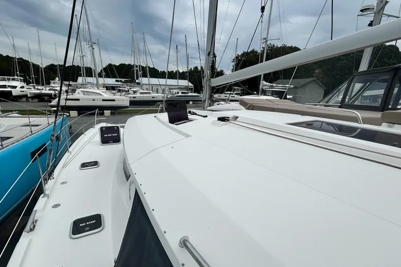  Yacht Photos Pics 2019 Fountaine Pajot Helia 44 Evolution catamaran docked at marina, showcasing sleek design.