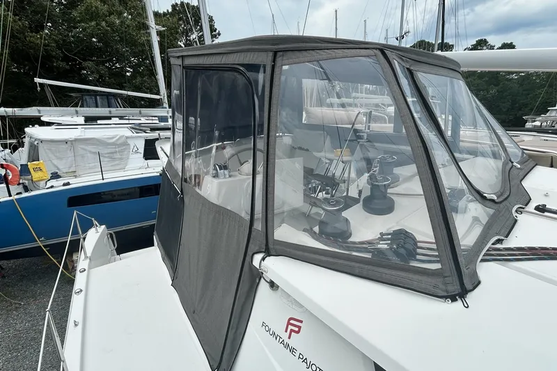  Yacht Photos Pics 2019 Fountaine Pajot Helia 44 Evolution catamaran with enclosed cockpit at marina.