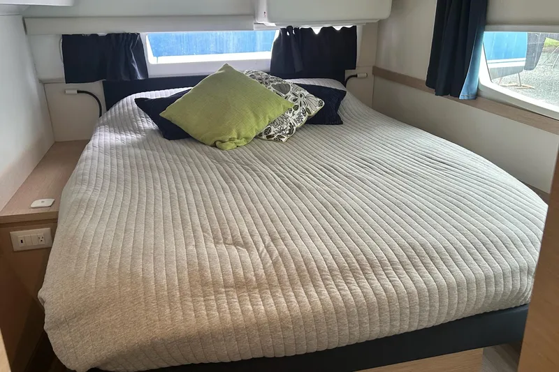  Yacht Photos Pics Cozy bedroom in 2019 Fountaine Pajot Helia 44 Evolution yacht with pillows and natural light.