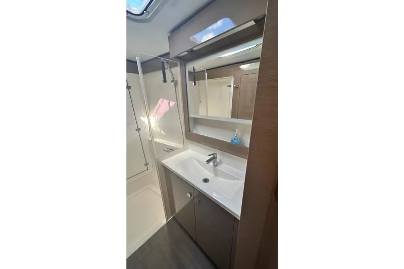  Yacht Photos Pics Modern bathroom in 2019 Fountaine Pajot Helia 44 Evolution yacht, featuring sleek sink and shower.