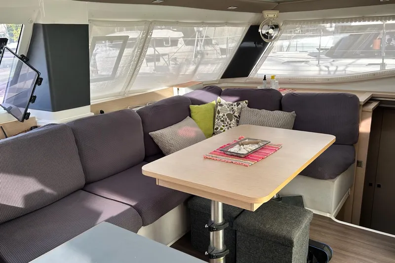  Yacht Photos Pics Interior of 2019 Fountaine Pajot Helia 44 Evolution catamaran with cozy seating and dining area.