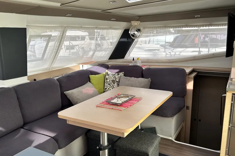  Yacht Photos Pics Interior of 2019 Fountaine Pajot Helia 44 Evolution catamaran with cozy seating and dining area.