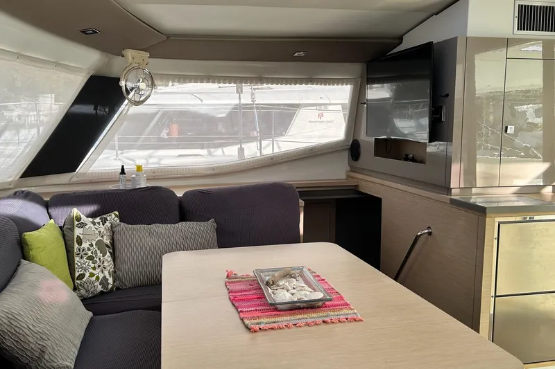  Yacht Photos Pics Interior of 2019 Fountaine Pajot Helia 44 Evolution catamaran with cozy seating and modern decor.