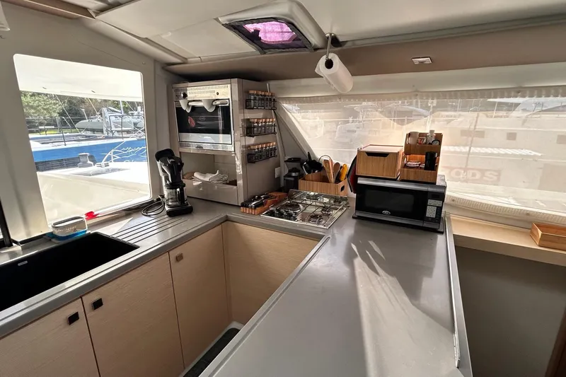  Yacht Photos Pics Modern kitchen interior of 2019 Fountaine Pajot Helia 44 Evolution catamaran.