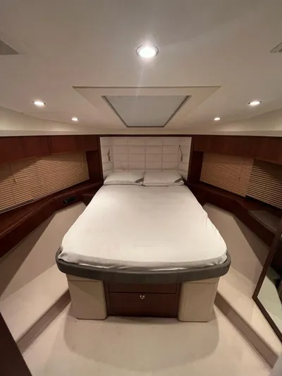  Yacht Photos Pics Luxurious cabin interior of 2011 Princess 64 yacht with elegant bedding and ambient lighting.