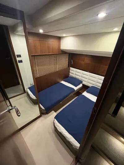  Yacht Photos Pics 2011 Princess 64 yacht cabin with twin beds, modern wood paneling, and ambient lighting.