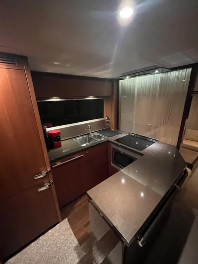  Yacht Photos Pics Luxurious kitchen interior of a 2011 Princess 64 yacht with modern appliances.