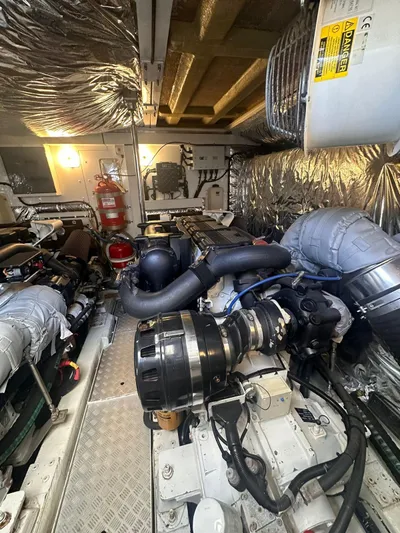  Yacht Photos Pics Engine room of a 2011 Princess 64 yacht, showcasing machinery and equipment.