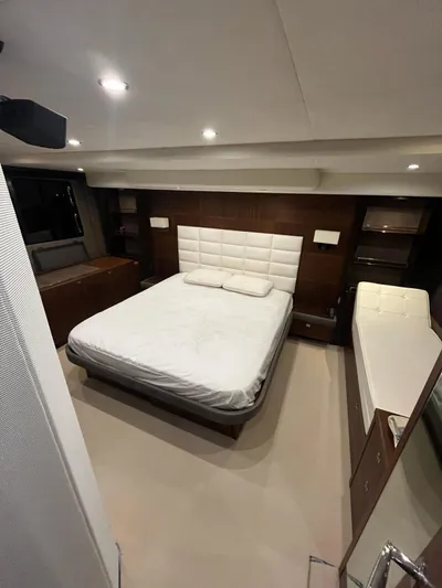  Yacht Photos Pics Luxurious bedroom interior of 2011 Princess 64 yacht with modern design and ambient lighting.