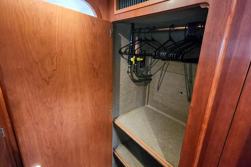 Cinnamon Yacht Photos Pics Wooden closet interior with hangers and shelves in 2019 Antares 44GT yacht.