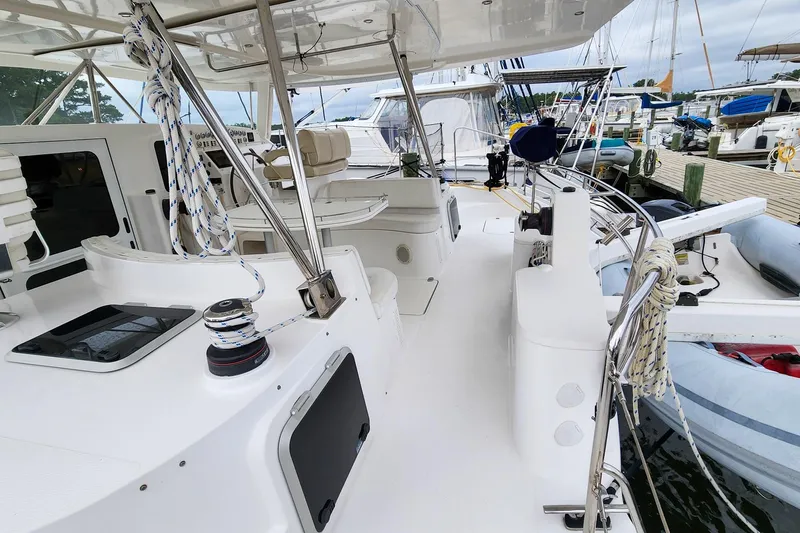 Cinnamon Yacht Photos Pics 2019 Antares 44GT yacht deck with ropes and seating in a marina.
