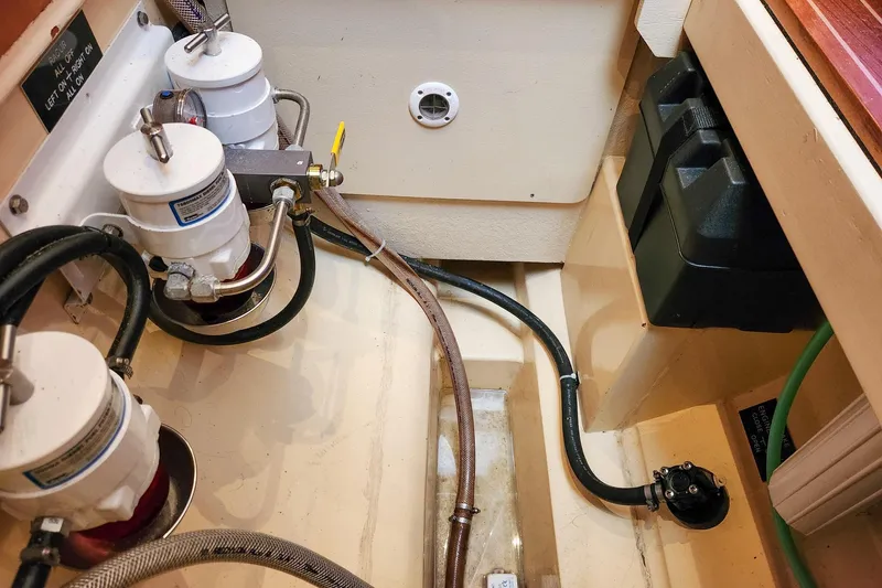 Cinnamon Yacht Photos Pics Engine compartment of 2019 Antares 44GT with fuel filters and battery box.