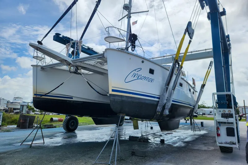 Cinnamon Yacht Photos Pics 2019 Antares 44GT catamaran "Cinnamon" lifted for maintenance at a boatyard.