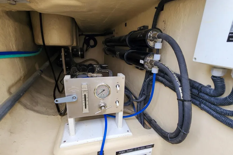 Cinnamon Yacht Photos Pics Engine room of 2019 Antares 44GT yacht with control panel and pipes.