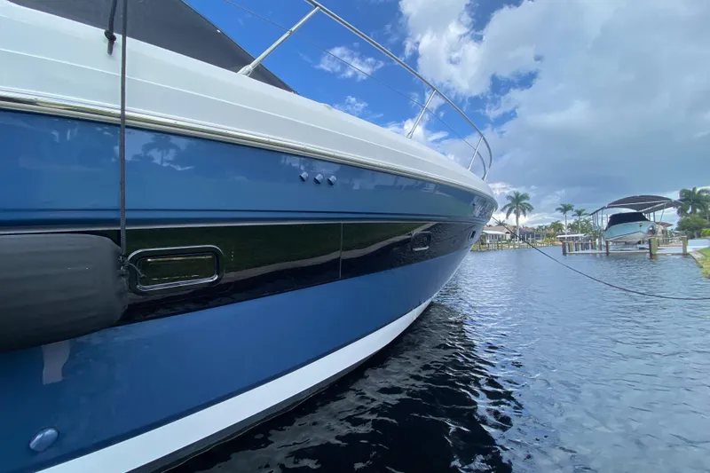  Yacht Photos Pics Azimut Atlantis 45 yacht, 2021 model, docked on a sunny day with blue skies.